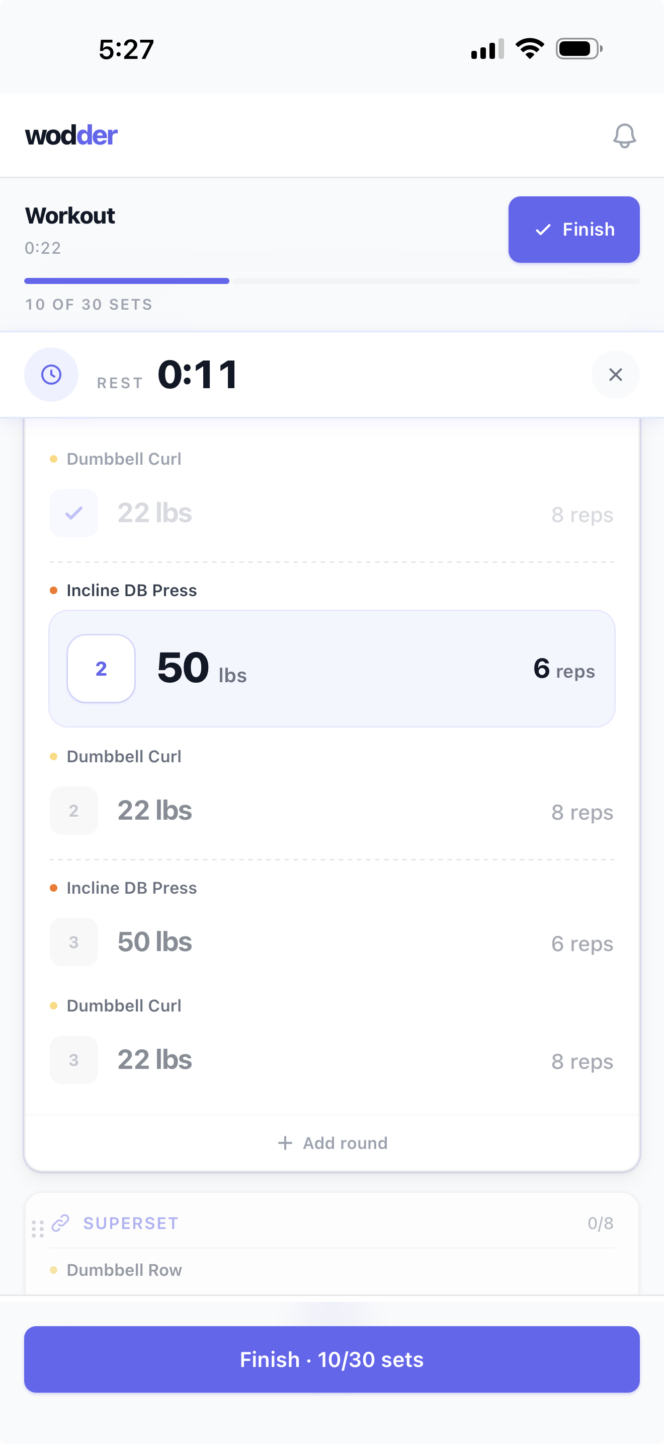 Wodder live session view mid-workout — a color-coded superset with rest timer running.